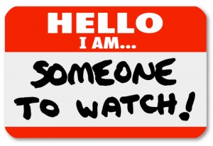 A namtag sticker with the words Hello I Am Someone to Watch to single out a special person or job candidate