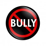 A black and red  button with word Bully isolated on a white background, No Bully button